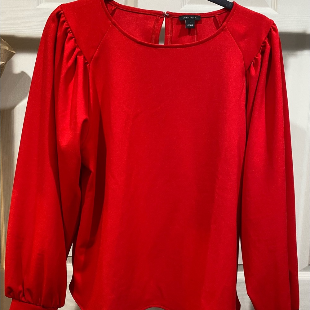 Ann Taylor beautiful red blouse. Slightly thick polyester for a nice flow.